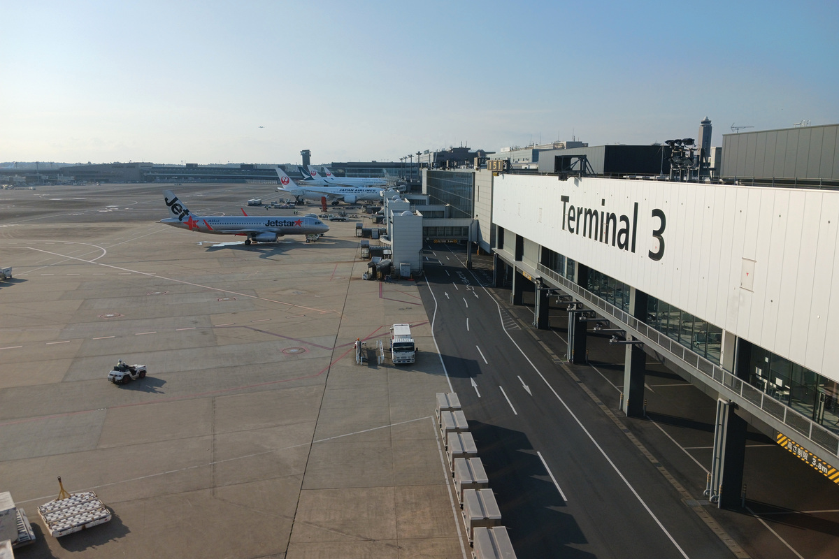 Narita Airport Terminal 3 building with aircraft parked on the apron