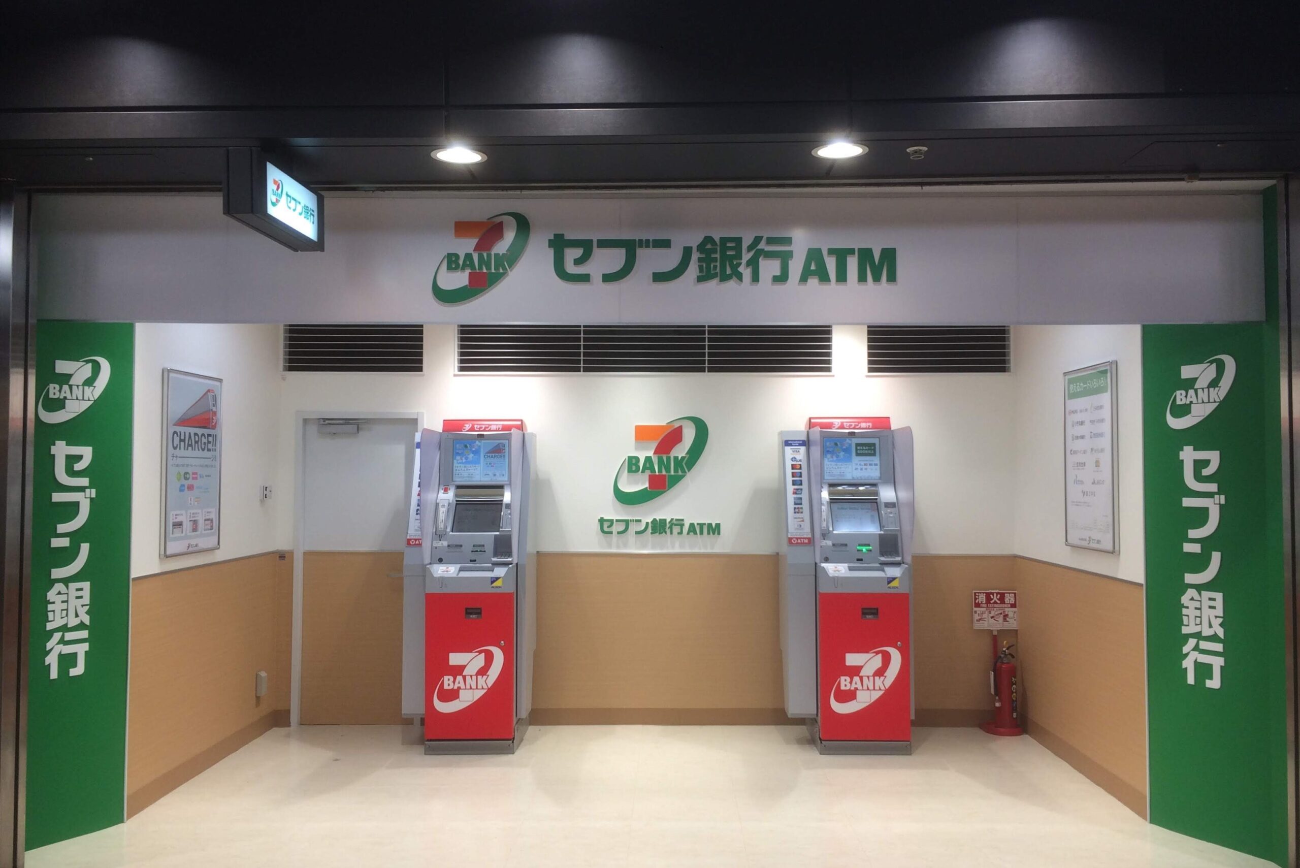 Two Seven Bank ATMs in a Japanese indoor banking area