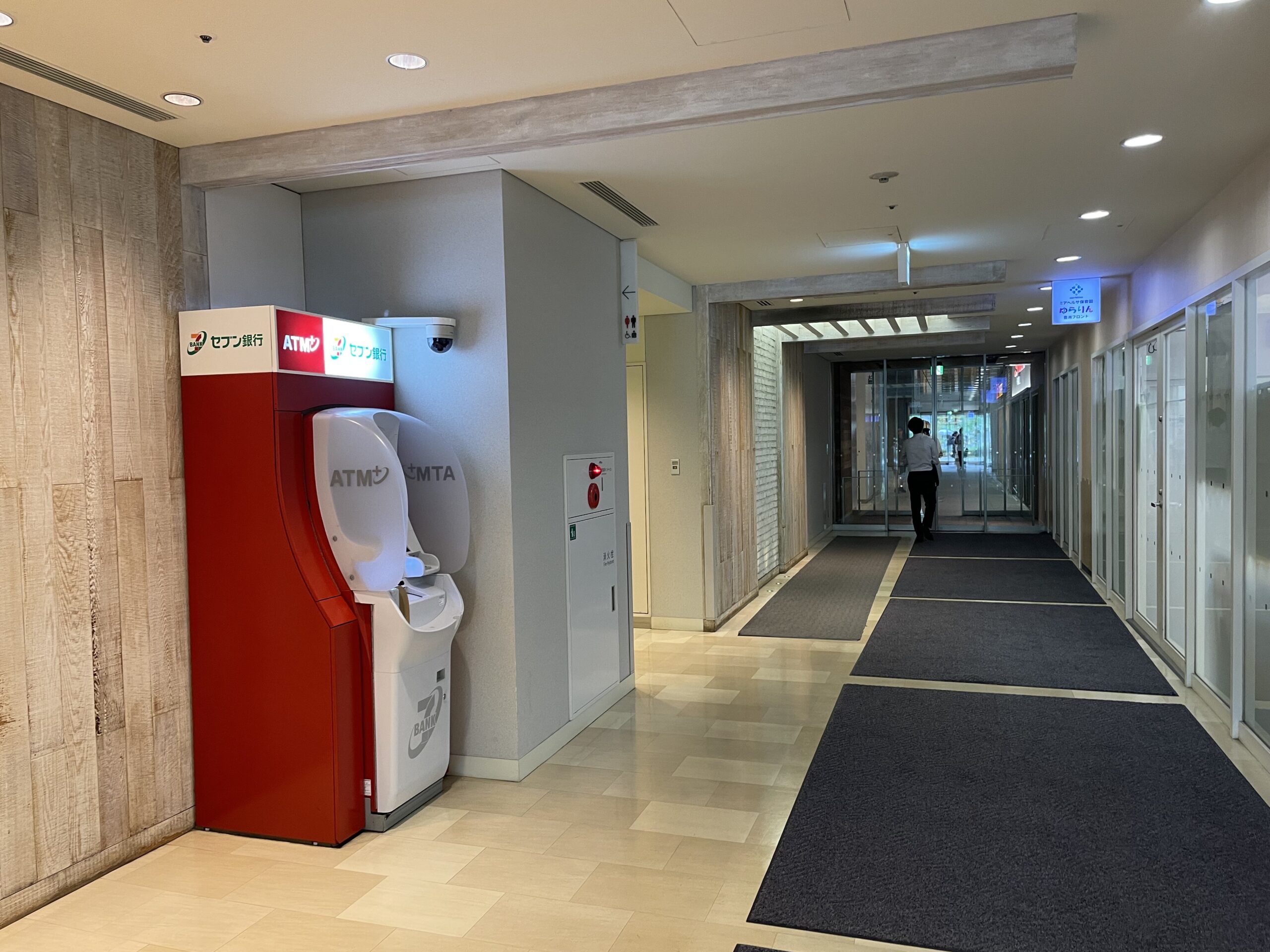 Red Seven Bank ATM installed in a bright Japanese commercial corridor