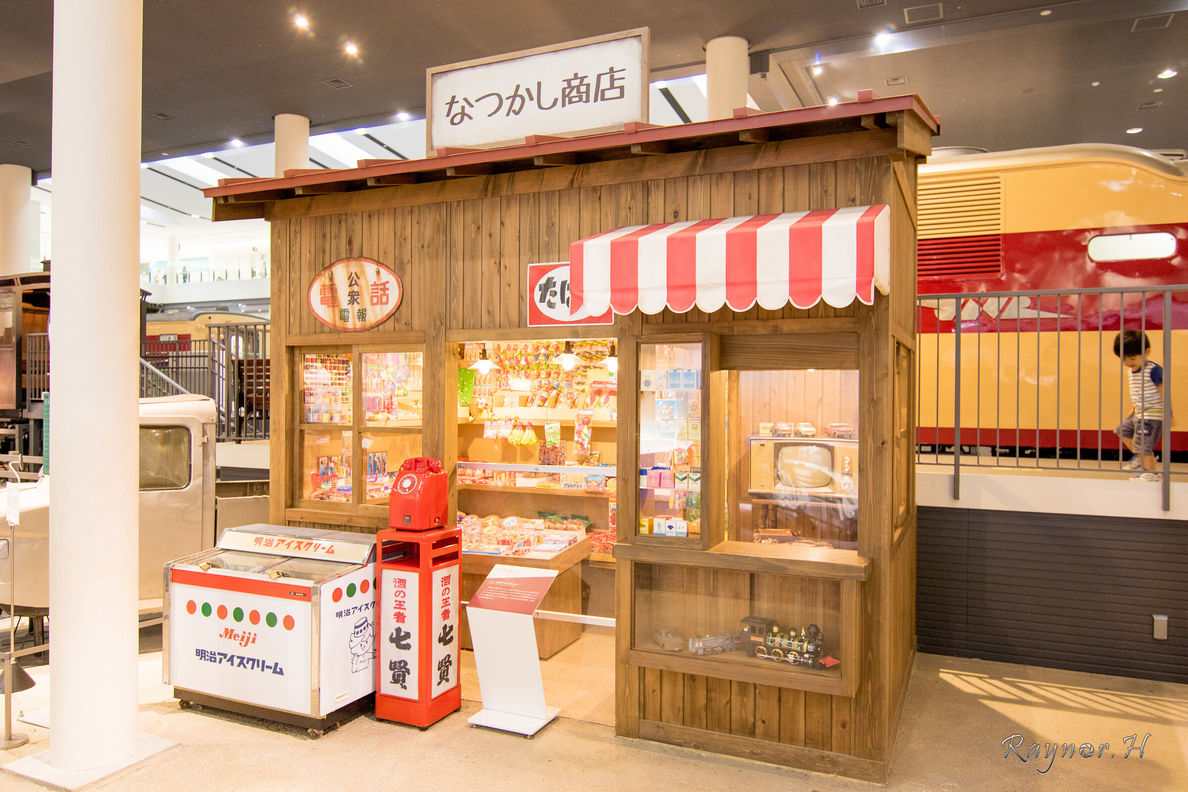 Wooden Japanese candy shop storefront with a sign reading なつかし商店