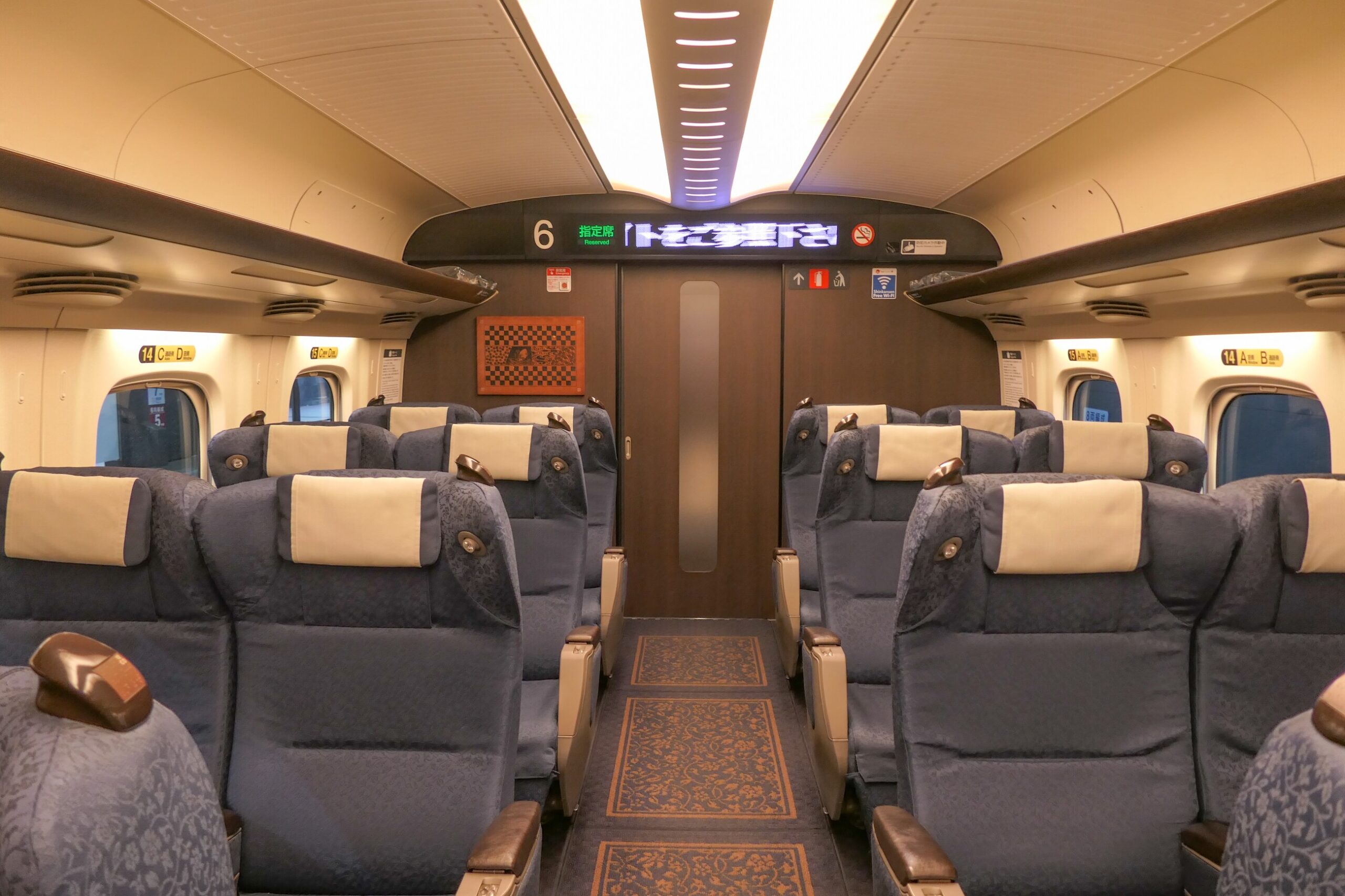 Rows of spacious Green Car seats inside an N700 Shinkansen
