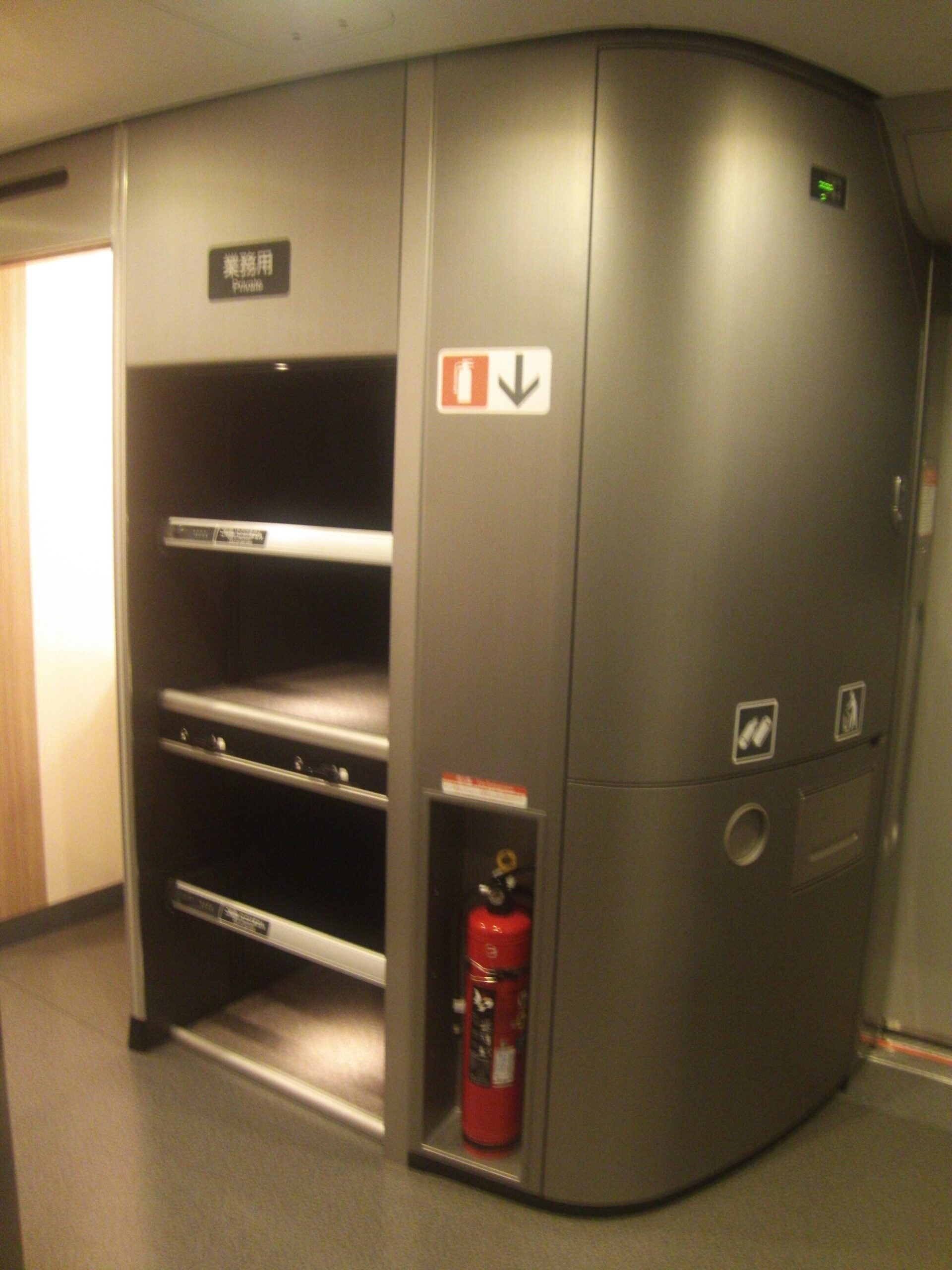 Onboard baggage storage shelves inside an N700S Shinkansen