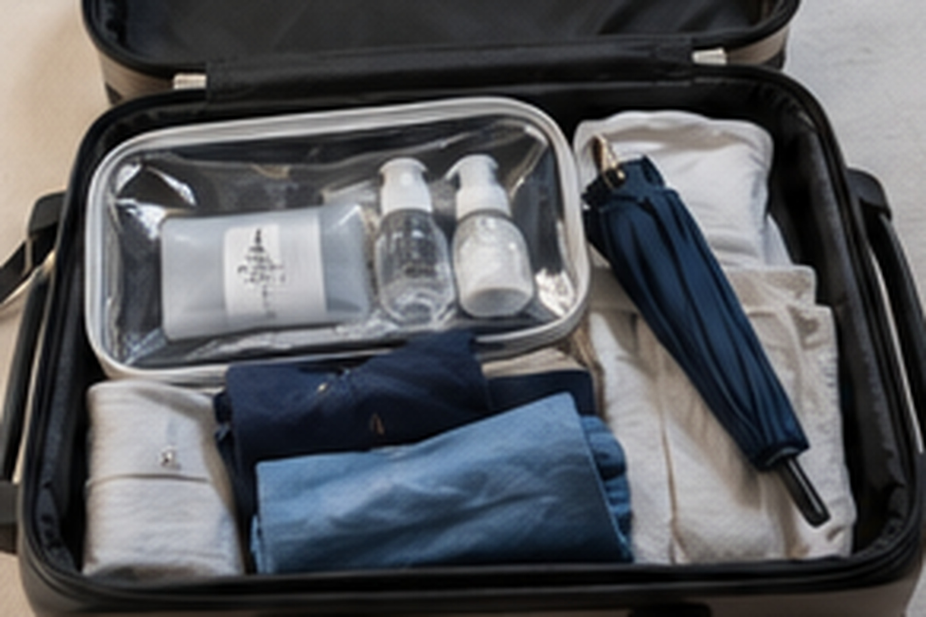Open suitcase packed for a private stay in Japan
