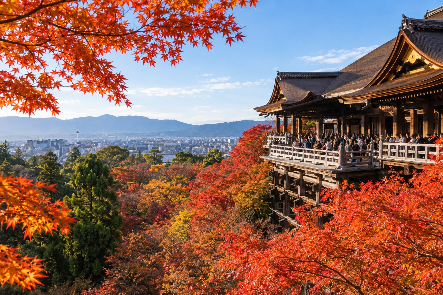 Historic Japanese temple terrace overlooking a city surrounded by bright autumn foliage
