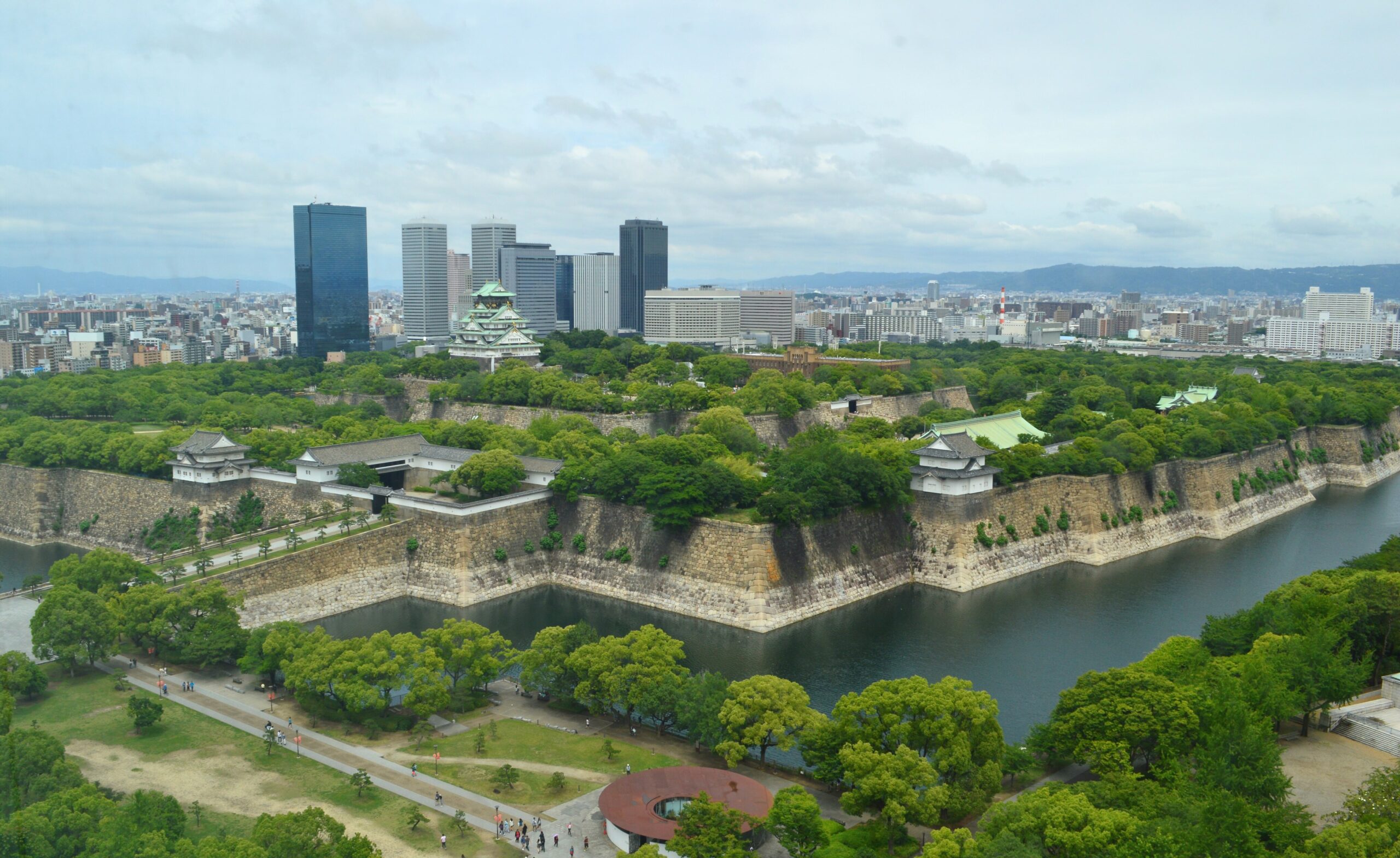 Osaka Castle, stone walls, moat and city skyline