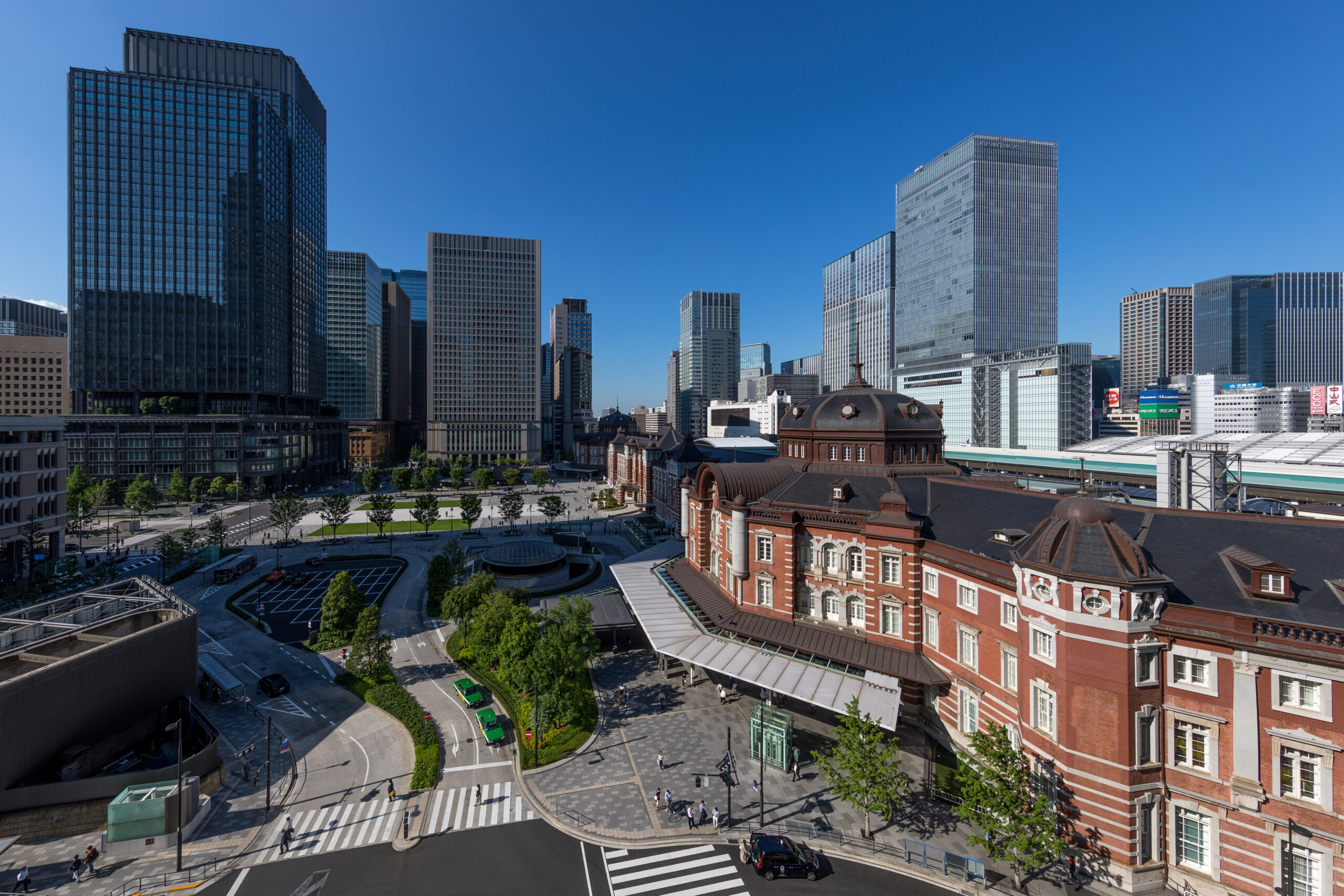 Tokyo Station Marunouchi building and central plaza under a blue sky