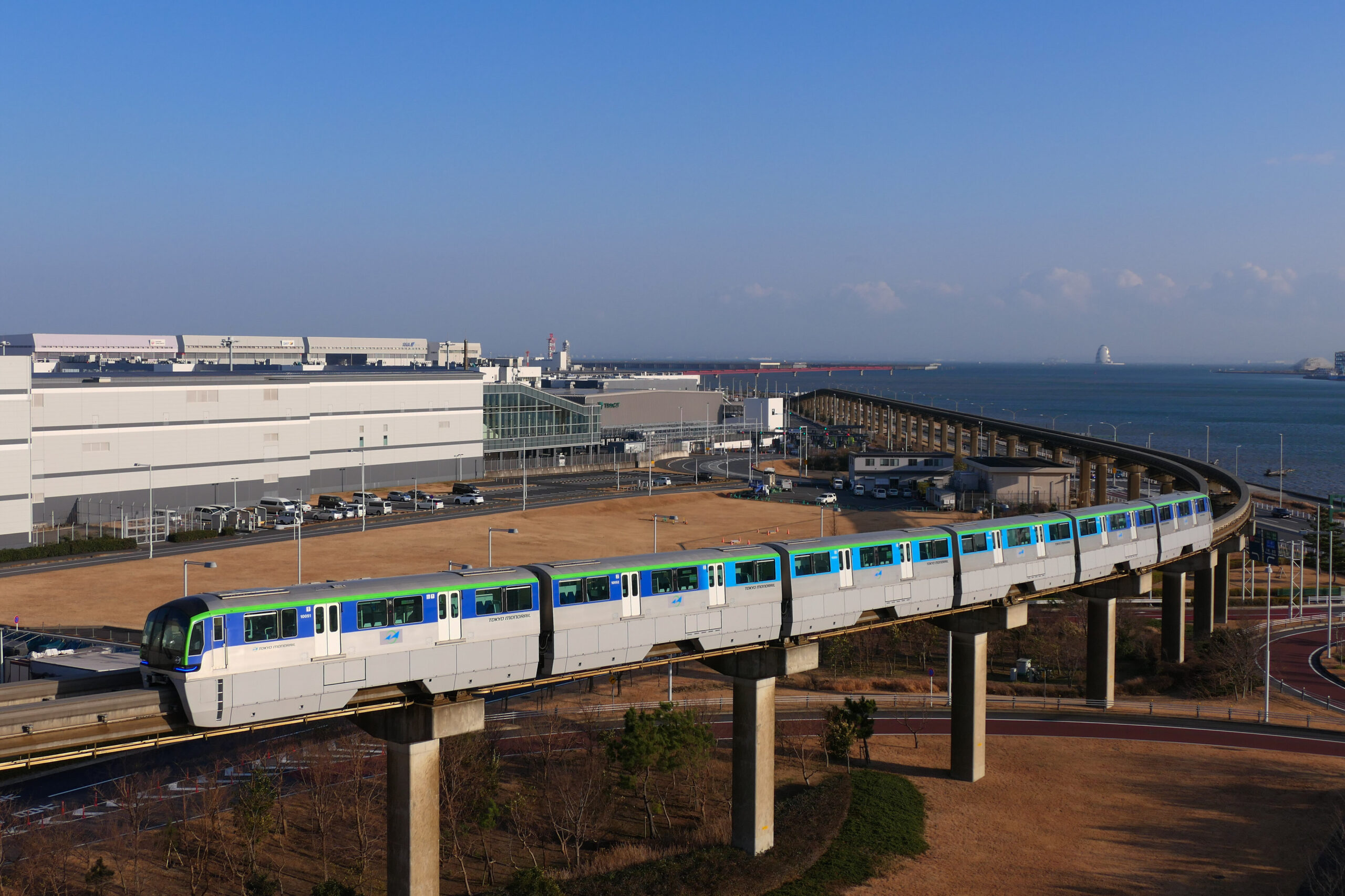 Tokyo Monorail train running beside Haneda Airport