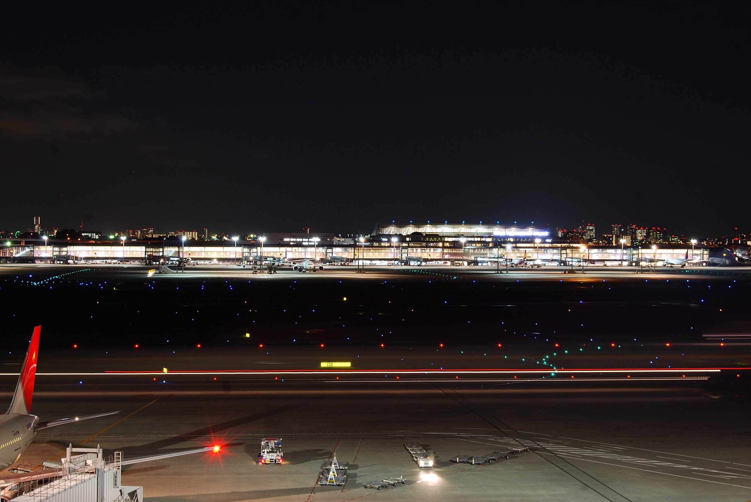 Haneda Airport runways and terminal lights at night