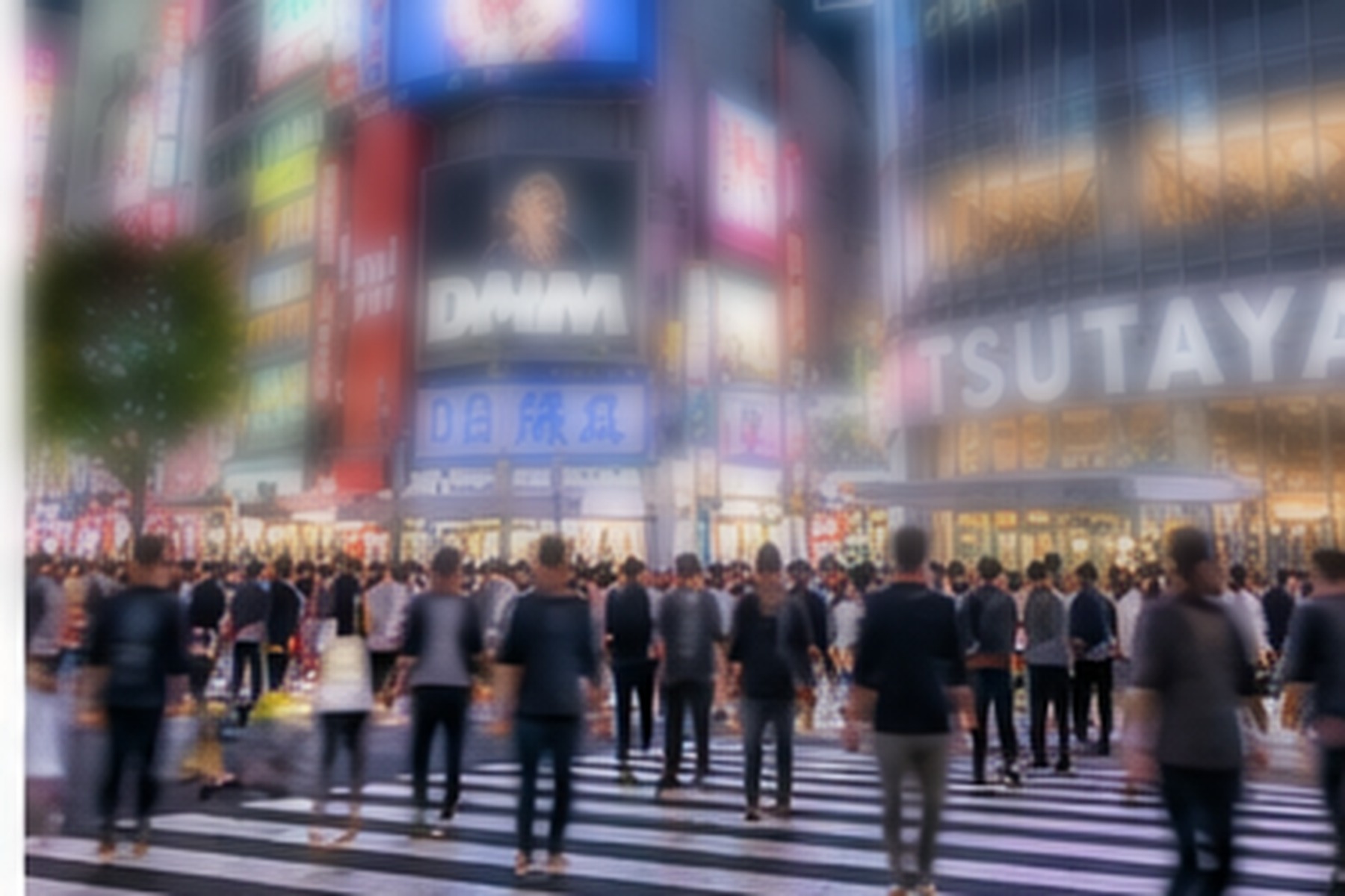 Crowds crossing a brightly lit street in Shibuya at night